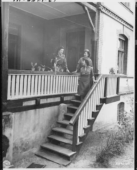 Captain Elizabeth Hoisington, in charge of WAC's in the Berlin conference area, gives final instructions to telephone…