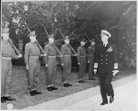 Fleet Adm. Ernest J. King, U. S. Navy, arrives at the residence of British Prime Minister Winston Churchill for a…