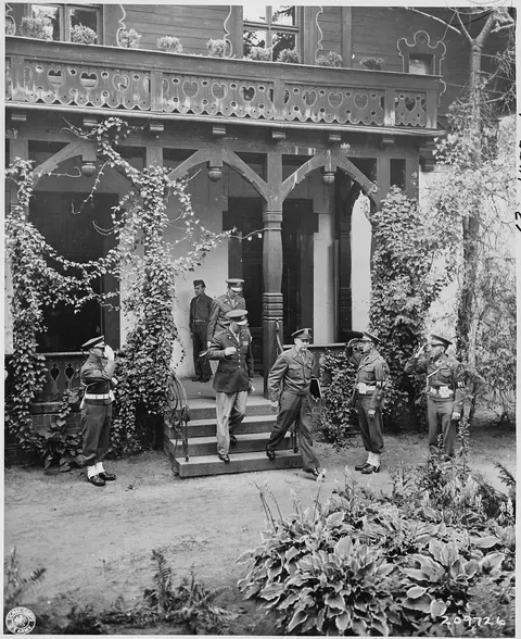Gen. Brehon B. Somervell leaves the Cecilienhof Palace, scene of the Potsdam Conference in Potsdam, Germany with Maj.…