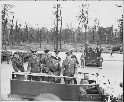 Correct title should be: Gen. George C. Marshall passes through the British Victory parade in Berlin, Germany during the Potsdam Conference. L to R: Gen. Henry H. Arnold, Marshal of the RAF Sir Charles Portal, Field Marshal Sir Harold Alexander, Adm. Ernest J. King (behind Gen. Marshall).