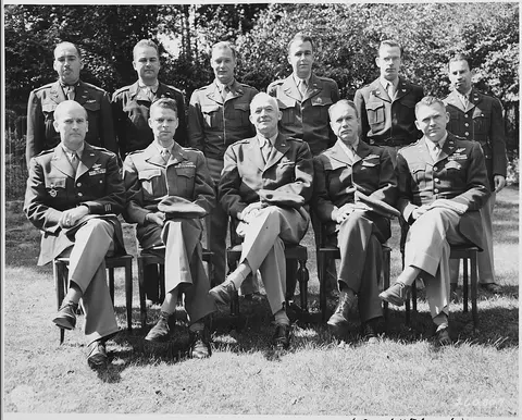 Gen. Henry "Hap" Arnold with his staff posing outdoors during the Potsdam Conference in Germany.