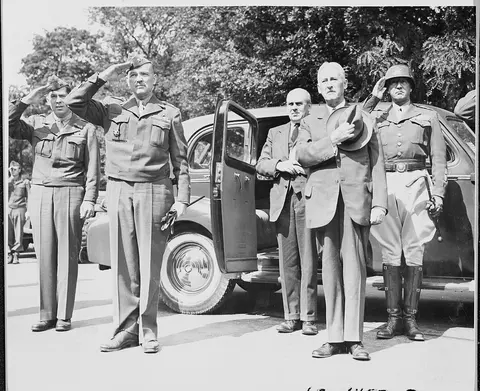 L to R, Unidentified officer, Maj. Gen. Floyd Parks, Commanding General, Berlin District, John J. McCloyd, Assistant…