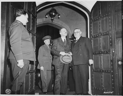 Newly appointed British Prime Minister Clement Attlee (left) accompanied by foreign minister Ernest Bevin arrives at…