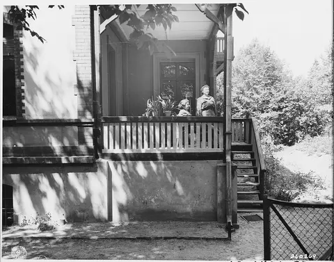 S-Sgt. Mary Haluey of Cambridge, Massachusetts, is watching the parade of delegates entering the Potsdam Conference…