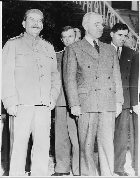 Soviet Prime Minister Josef Stalin poses with President Harry S. Truman during the Potsdam Conference in Germany. V.…