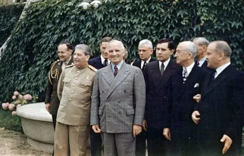Harry S. Truman and Joseph Stalin meeting at the Potsdam Conference on 18 July 1945. From left to right, first row: Stalin , Truman , Soviet Ambassador Gromyko , US Secretary of State Byrnes , and Soviet Foreign Minister Molotov . Second row: Truman confidant Vaughan [1] , Russian interpreter Bohlen , Truman naval aide Vardaman , and Ross (partially obscured).