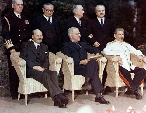 USA C-1860 (Color): Potsdam Conference, July-August 1945. The Big Three pose with their principal advisors, at Potsdam, Germany, circa 28 July 1 August 1945. The three heads of government are (seated, left to right): British Prime Minister Clement Atlee; U.S. President Harry S. Truman; Soviet Premier Joseph Stalin. Standing behind them are (left ot right): Fleet Admiral William D. Leahy, USN, Truman's Chief of Staff; British Foreign Minister Ernest Bevin; U.S. Secretary of State James F. Byrnes; Soviet Foreign Minister Vyacheslav Molotov. Photograph from the Army Signal Corps Collection in the U.S. National Archives. (2016/04/06).
