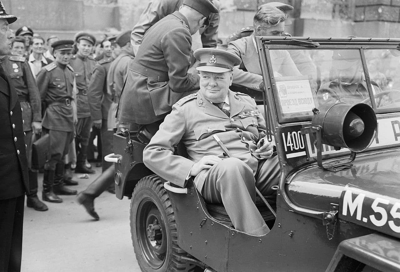 Churchill tours ruined Berlin (pictured in front of the Reichstag)