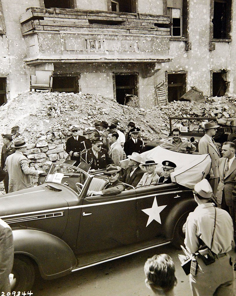 Truman tours ruined Berlin (pictured in front of the ruins of Hitler's Chancellery)/Image: US National Archives and Records Administration